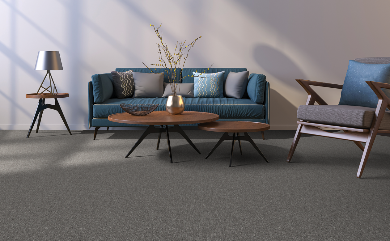 dark brown neutral carpet in living room installation with sofa